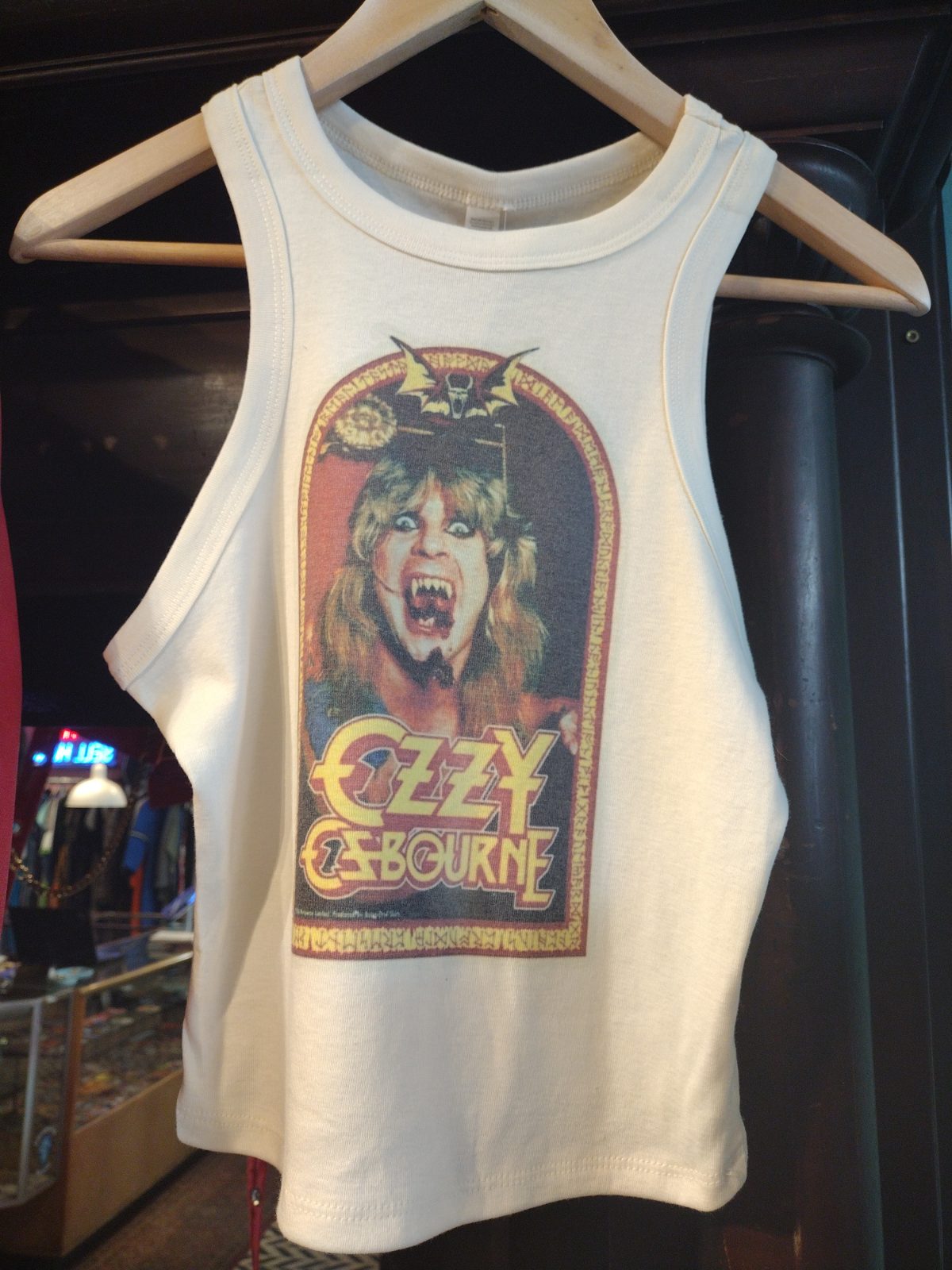 Cream Ozzy Osbourne tank top with a graphic of the singer's face and name.