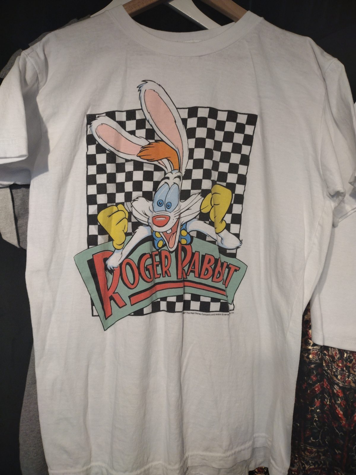 White t-shirt with Roger Rabbit graphic.